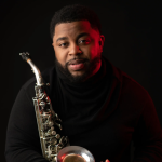 Gallery 1 - Photo of Dayve Stewart holding a saxophone