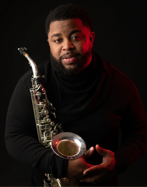 Gallery 1 - Photo of Dayve Stewart holding a saxophone