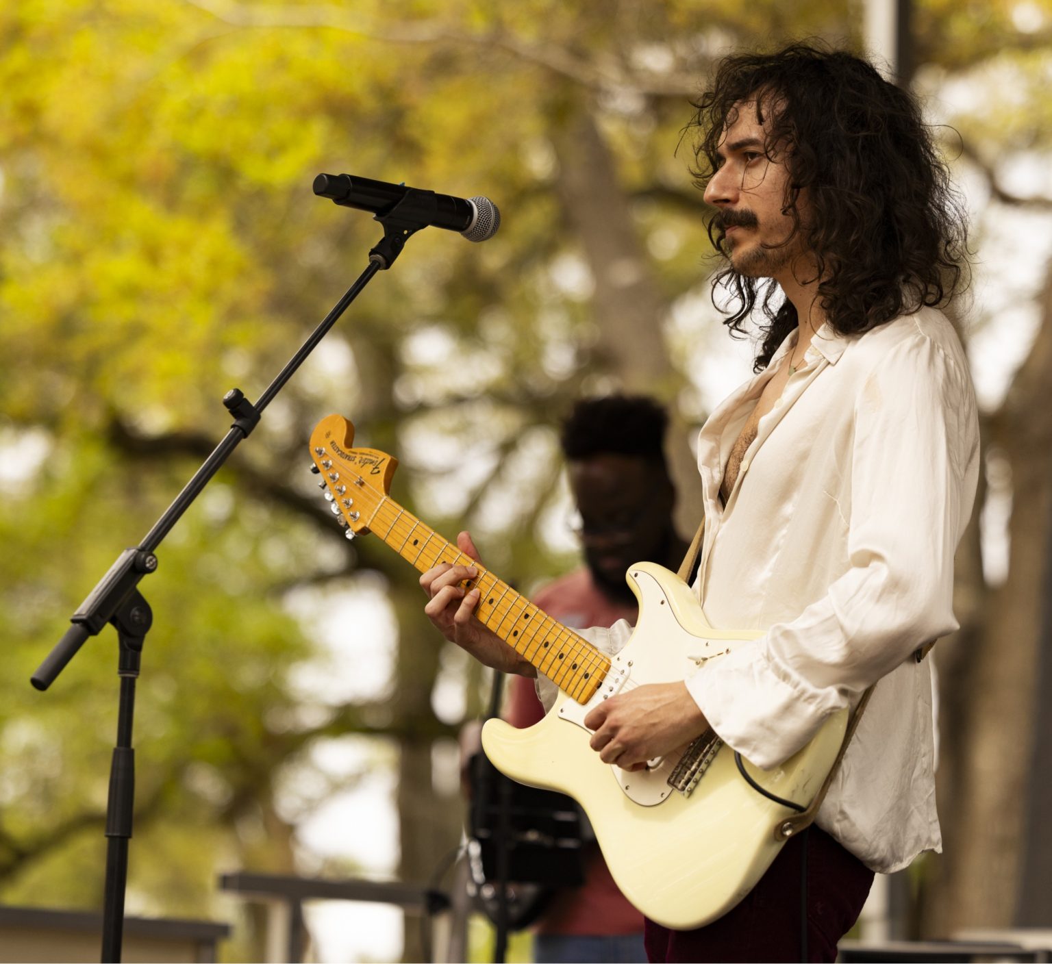Gallery 2 - Will Patrick plating guitar at the 2025 Mayor's Jazz in the Park.